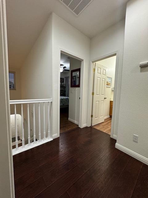 hallway featuring dark hardwood / wood-style flooring