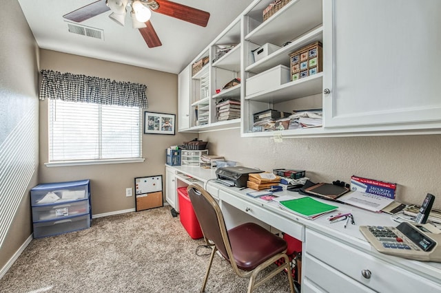 office space with light carpet and ceiling fan