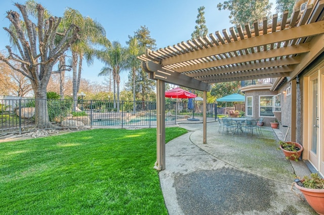 view of yard with a pergola and a patio