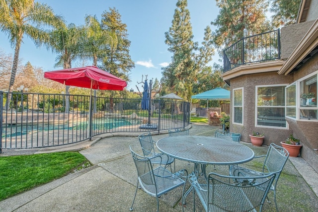 view of patio with a fenced in pool