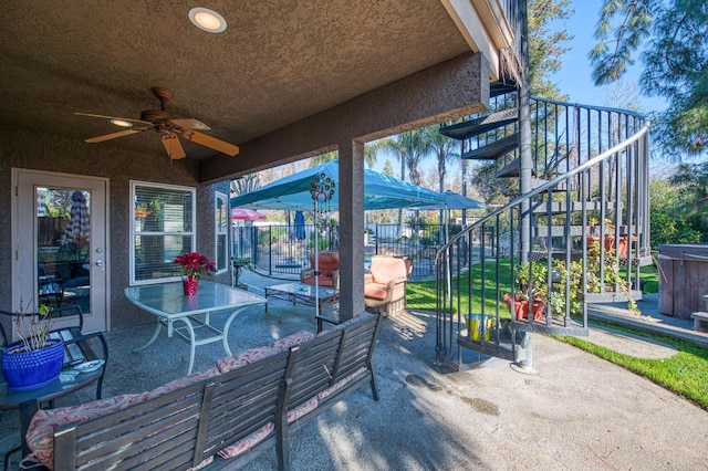 view of patio / terrace with an outdoor living space and ceiling fan