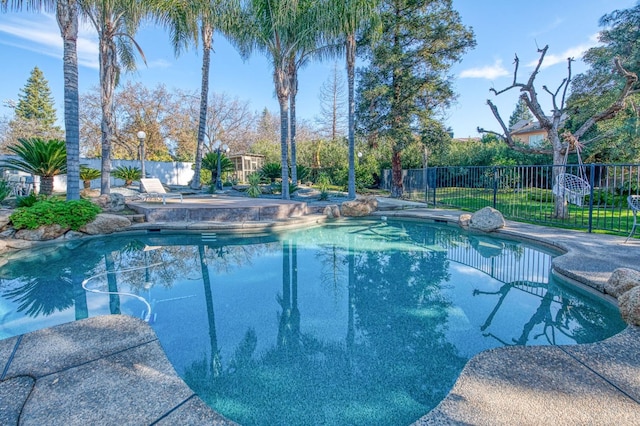 view of swimming pool with a patio