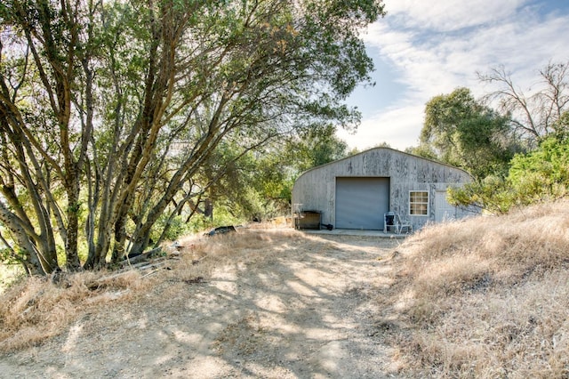 view of outbuilding featuring a garage