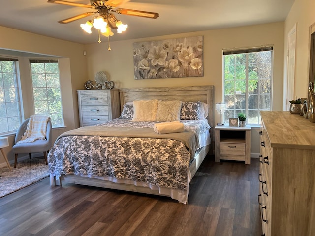 bedroom with ceiling fan and dark wood-type flooring