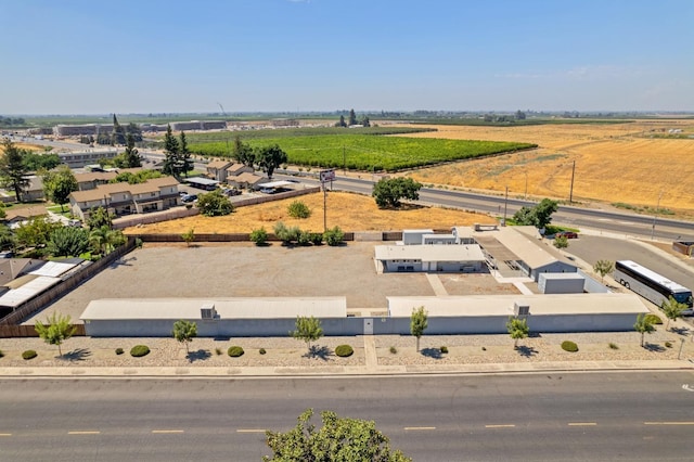 birds eye view of property with a rural view