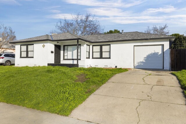 single story home featuring a front yard and a garage