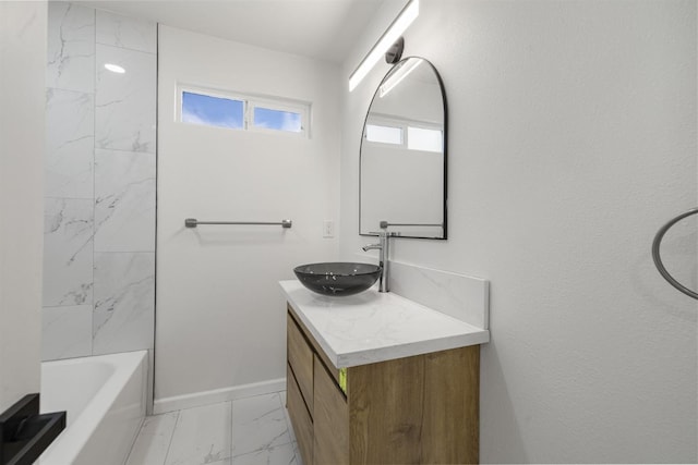 bathroom featuring vanity and tub / shower combination