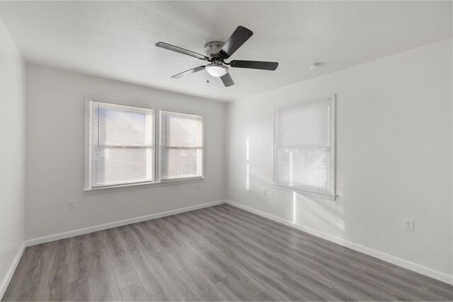 unfurnished room featuring ceiling fan and light hardwood / wood-style flooring