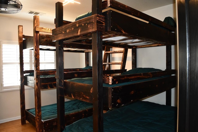 bedroom featuring wood-type flooring