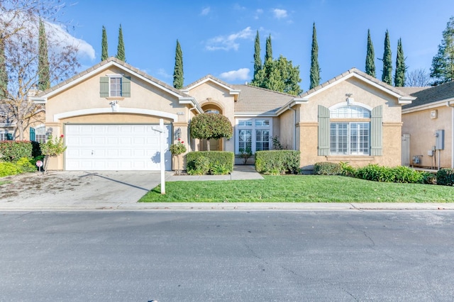 single story home with a front lawn and a garage