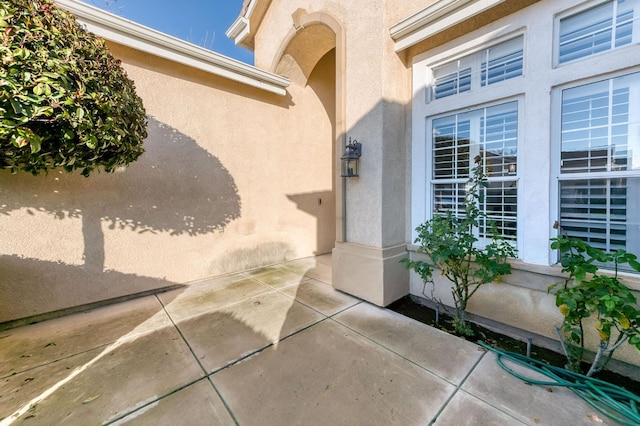 property entrance with a patio