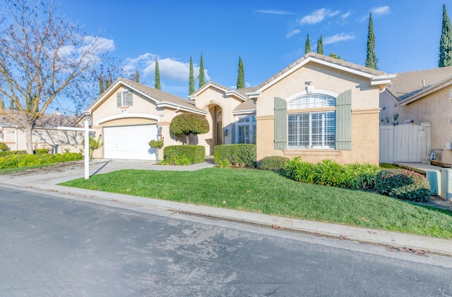 single story home featuring a garage and a front lawn