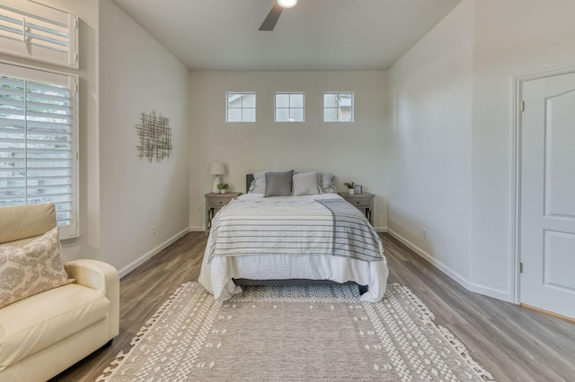 bedroom with hardwood / wood-style floors and ceiling fan