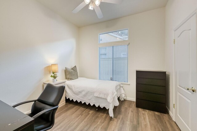 bedroom featuring ceiling fan and hardwood / wood-style floors