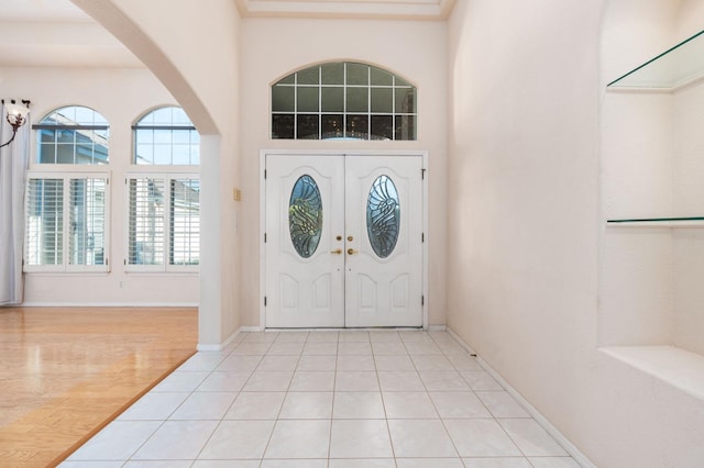 foyer featuring light tile patterned floors