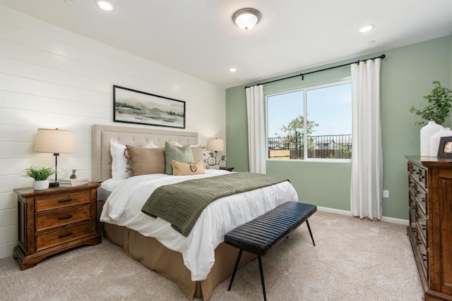 bedroom with light carpet, recessed lighting, and baseboards