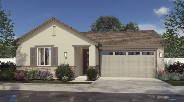 view of front of home featuring stone siding, stucco siding, concrete driveway, and a garage