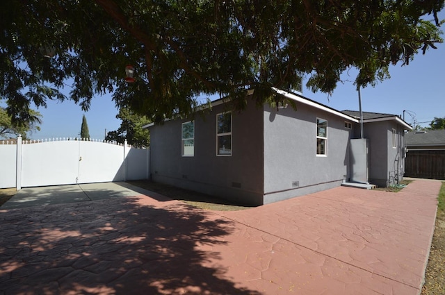 view of property exterior featuring a patio