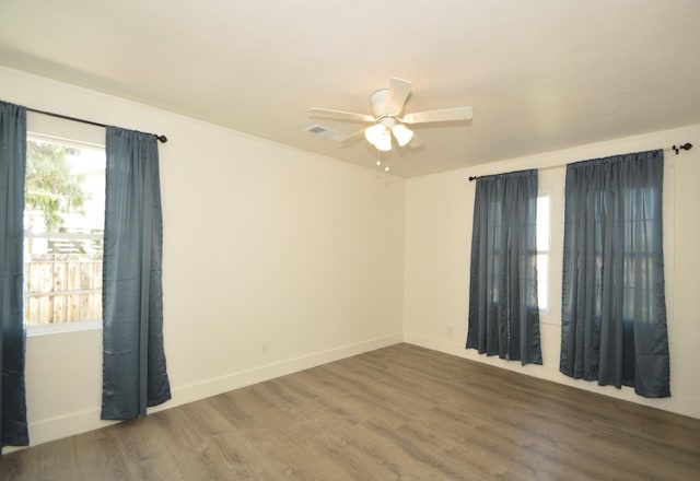 unfurnished room with ceiling fan and hardwood / wood-style floors