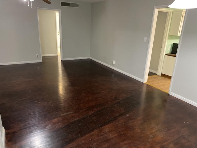 spare room with hardwood / wood-style flooring