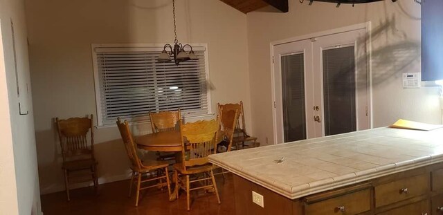 dining area featuring lofted ceiling