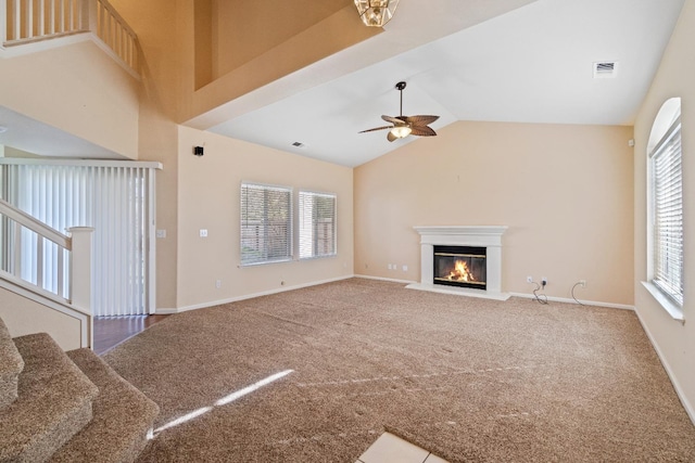 unfurnished living room featuring carpet flooring, ceiling fan, and lofted ceiling