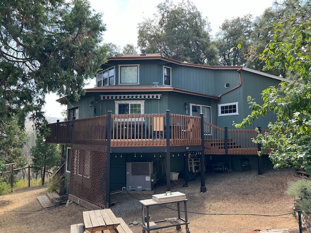 back of house with a wooden deck