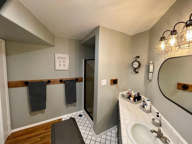 bathroom featuring vanity and a shower with shower door