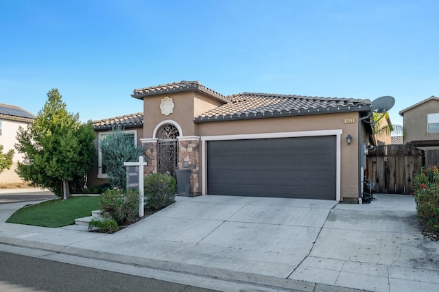 mediterranean / spanish-style home featuring a garage