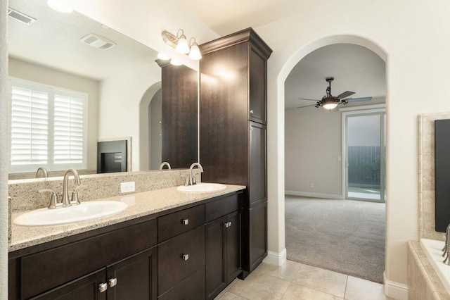 bathroom featuring ceiling fan, tile patterned flooring, and vanity