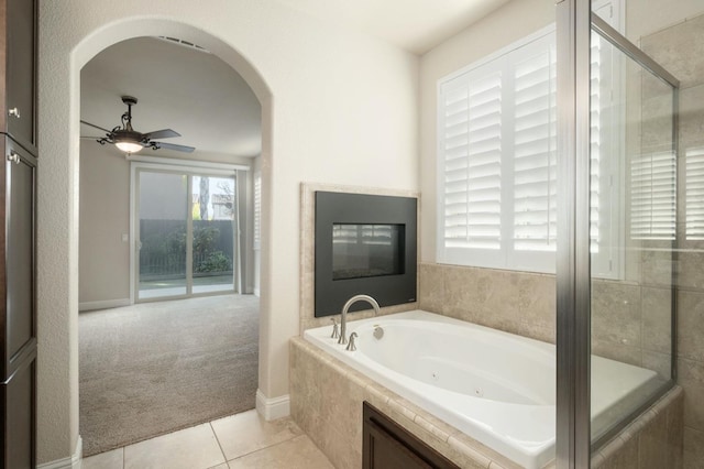 bathroom with separate shower and tub, ceiling fan, and tile patterned flooring