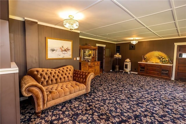 living room featuring carpet and wooden walls