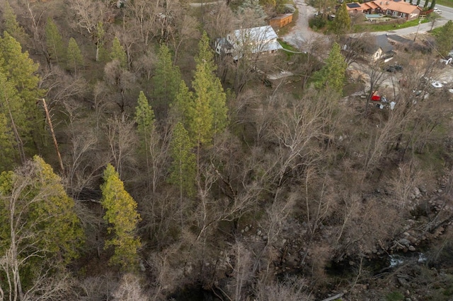 drone / aerial view with a view of trees