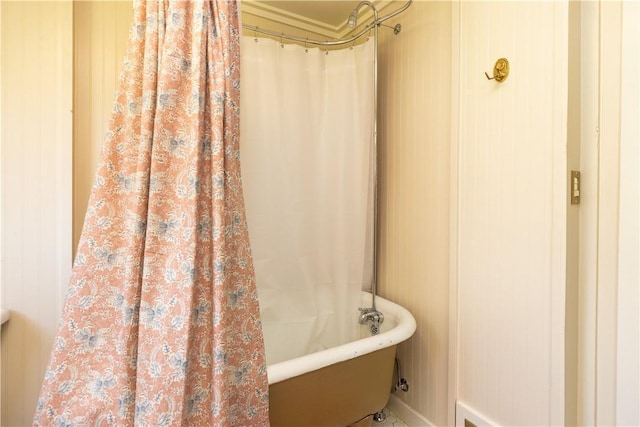 bathroom featuring a bath and a shower with curtain