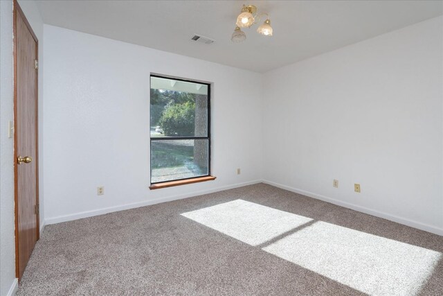 39627 Brandywine Ln, Oakhurst, CA 93644 - carpeted spare room with baseboards and a chandelier