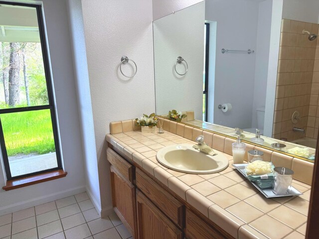 39627 Brandywine Ln, Oakhurst, CA 93644 - full bathroom with vanity, tile patterned flooring, and shower / washtub combination