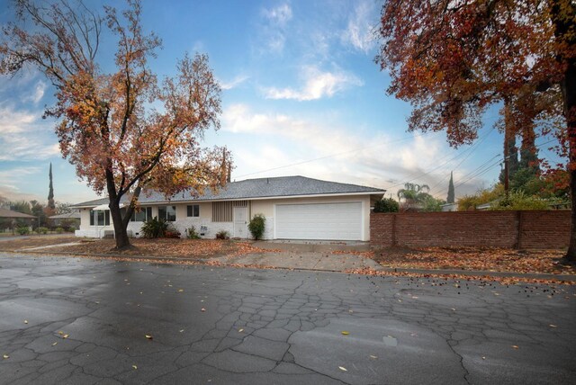 ranch-style home with a garage