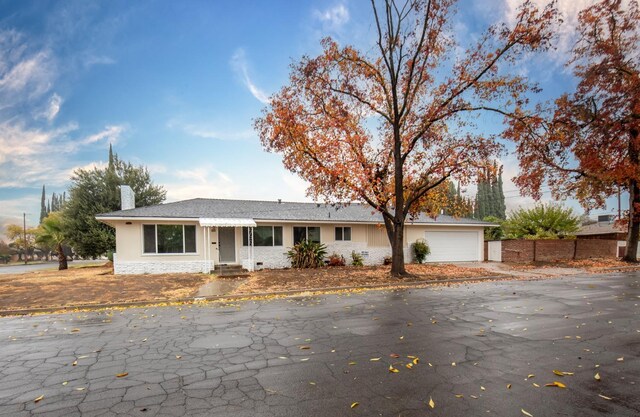 ranch-style house featuring a garage