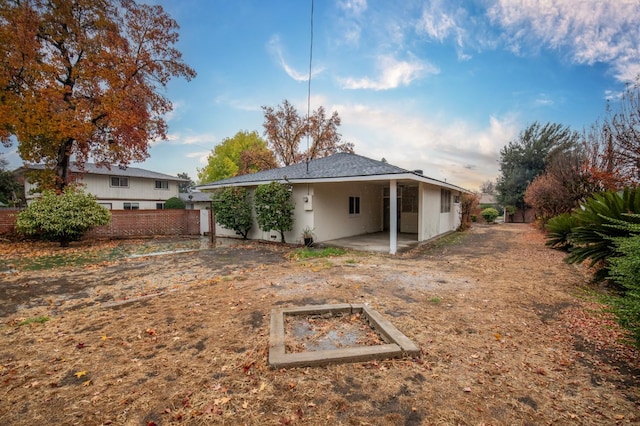 rear view of property featuring a patio area