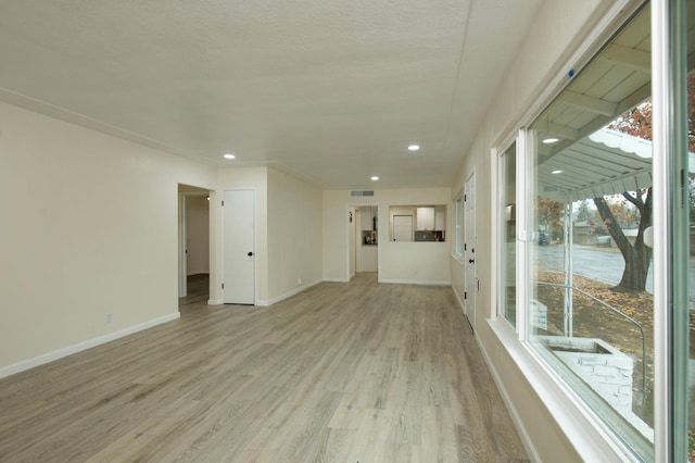 unfurnished room featuring light hardwood / wood-style floors