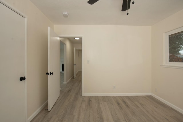 unfurnished room with ceiling fan and light hardwood / wood-style flooring