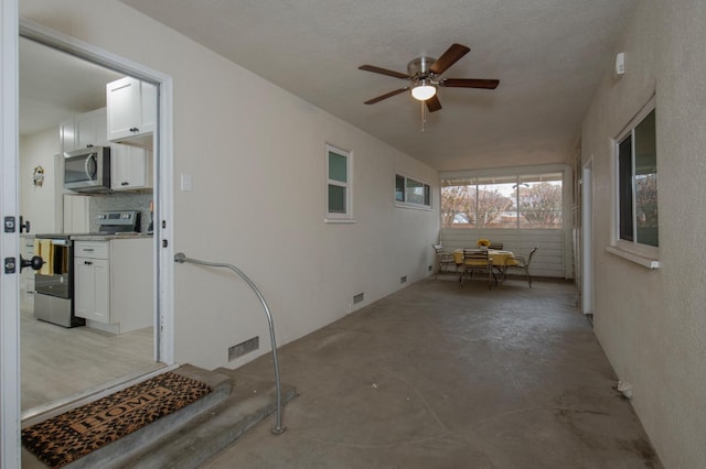 view of patio / terrace featuring ceiling fan