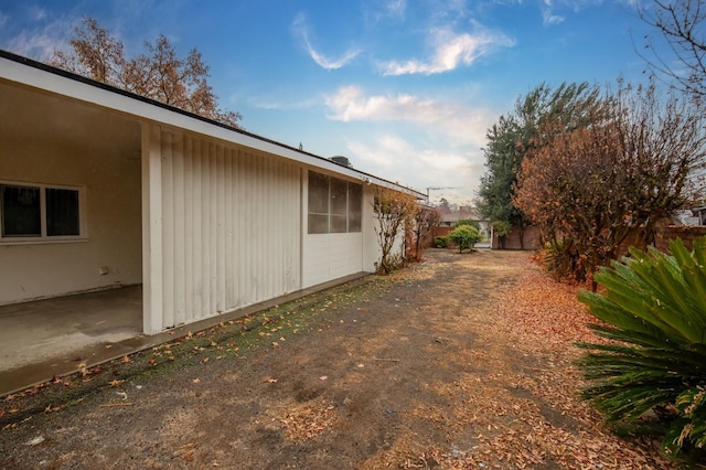 view of side of home featuring a patio area