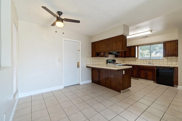 kitchen with kitchen peninsula, dishwasher, light tile patterned floors, ceiling fan, and stove