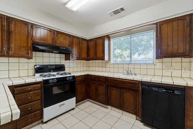 kitchen with dishwasher, tile counters, white range with gas cooktop, decorative backsplash, and sink