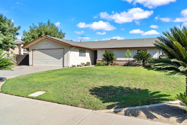 single story home with a front yard and a garage