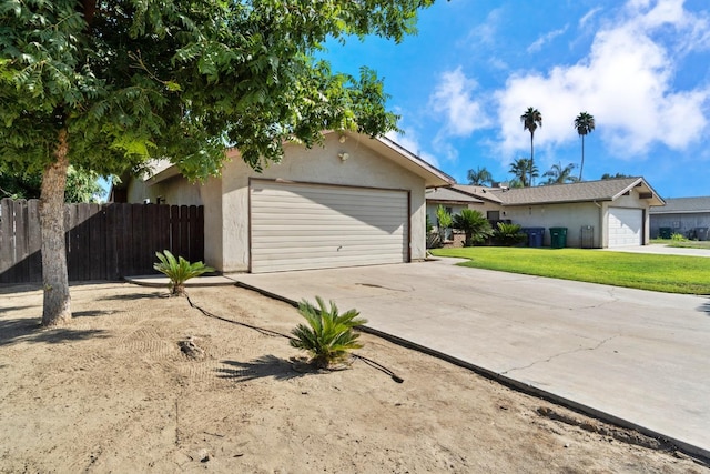 single story home with a front lawn and a garage