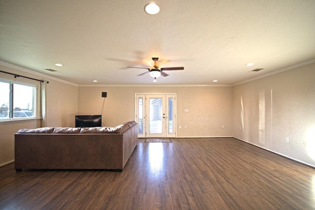 living room featuring dark hardwood / wood-style flooring, crown molding, and french doors