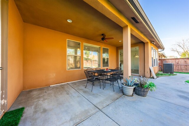 view of patio / terrace featuring ceiling fan and cooling unit