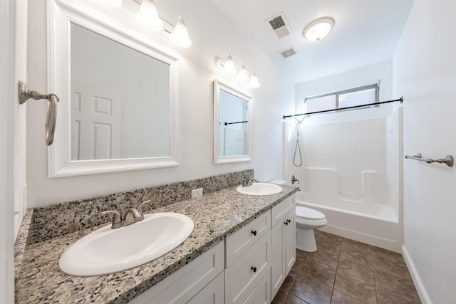 full bathroom with tile patterned floors, vanity, shower / bath combination, and toilet